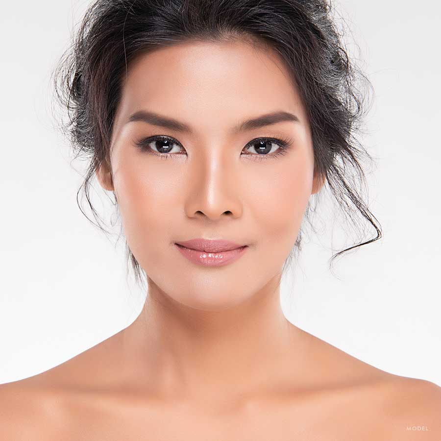 Headshot of a woman with her hair pulled back 