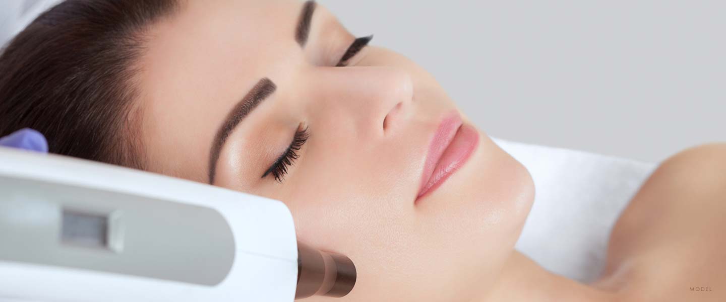 Headshot of a woman receiving non surgical facial treatment