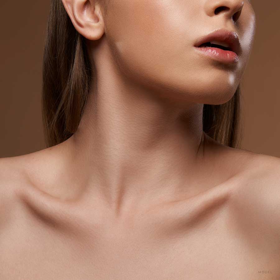 Close up of a female model's neck and bare shoulders 